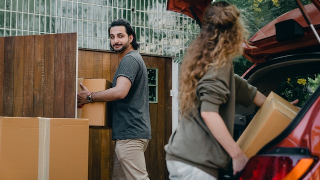 two%20people%20moving%20boxes